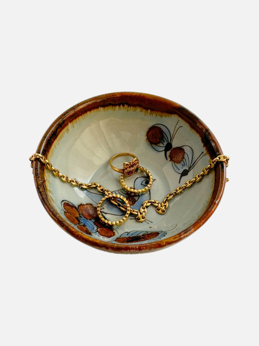 Vintage Ken Edwards Tonala hand-painted and signed round ceramic trinket bowl dish handmade in Mexico featuring bird and floral design shown with jewelry inside