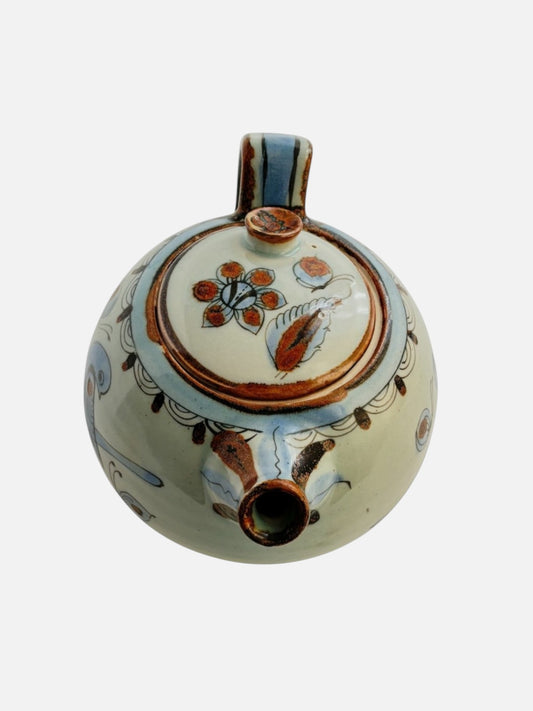 Vintage Ken Edwards Tonala hand-painted and signed round ceramic teapot with lid and handle handmade in Mexico featuring bird and floral design front view