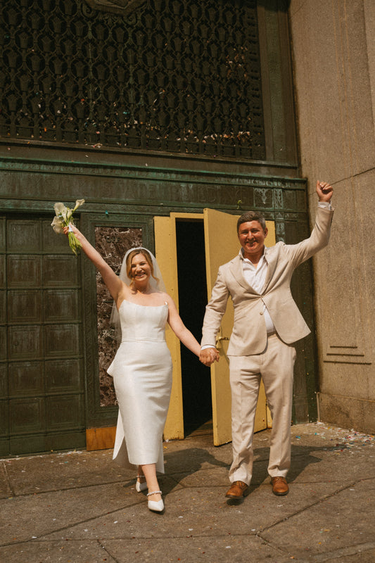 THE BRIDE WORE A SHORT VEIL TO CITY HALL