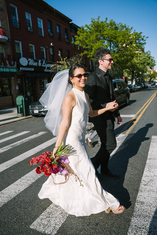 THE BRIDE WORE A VOLUMINOUS VEIL