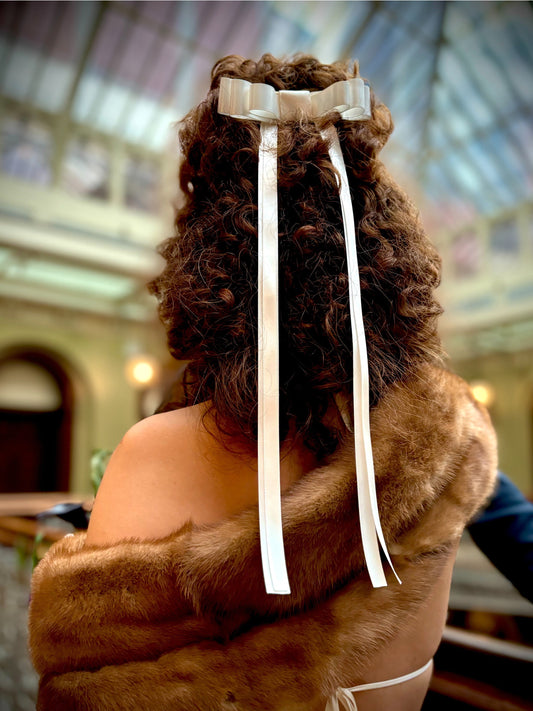 THE BRIDE WORE AN IVORY BOW TO CITY HALL