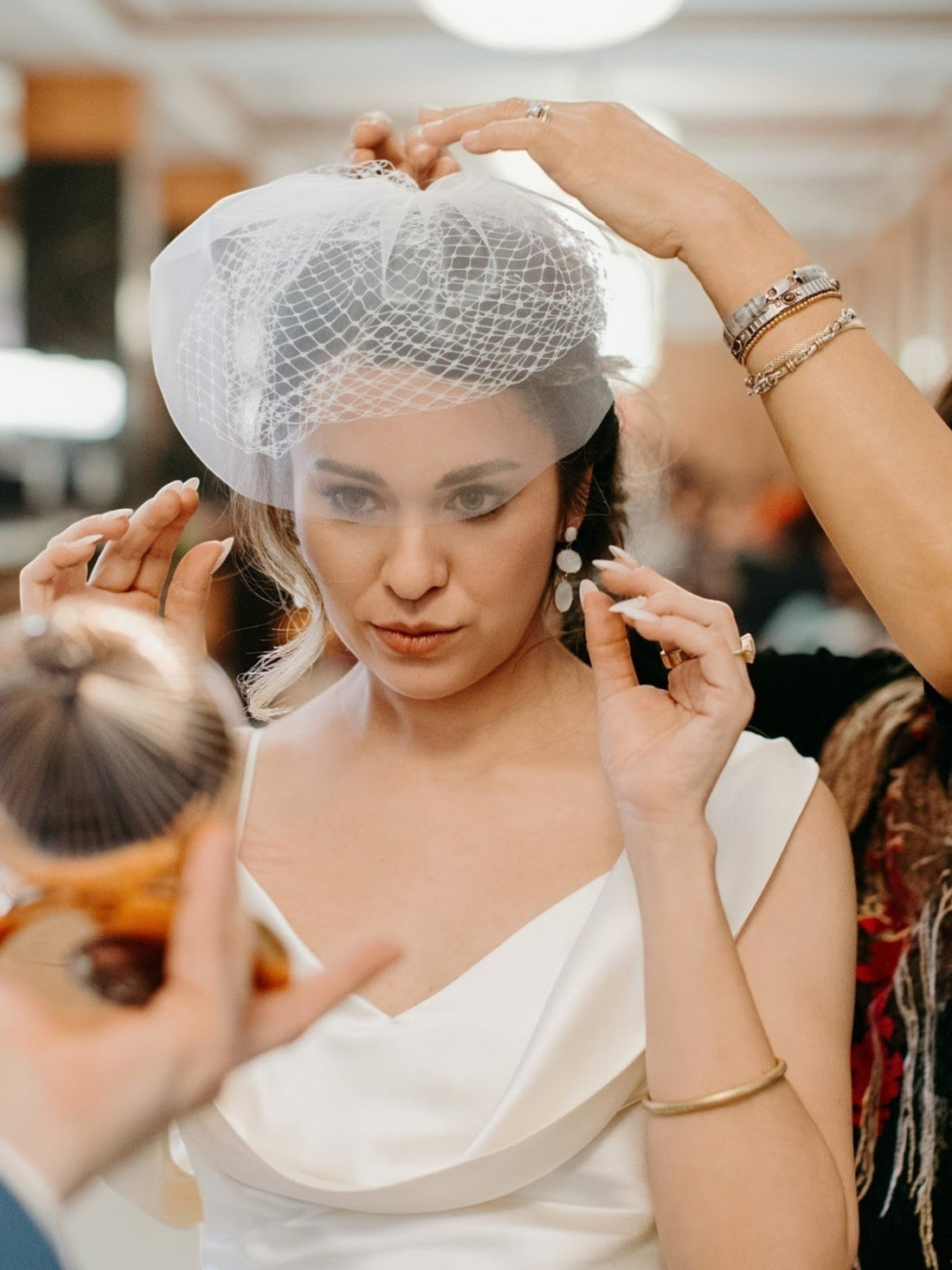THE BRIDE WORE A BIRDCAGE VEIL