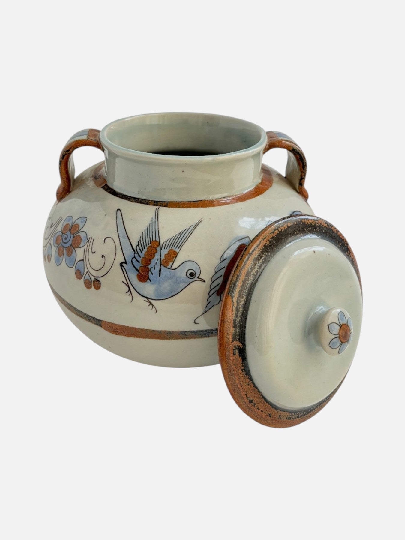 Vintage Ken Edwards Tonala hand-painted and signed round ceramic lidded pottery jar canister with handles handmade in Mexico featuring bird and floral design shown with the lid off